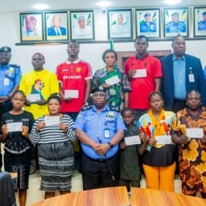 Akwa Ibom Commissioner of Police CP Baba Azare presenting welfare cheques to families of 51 deceased police officers.