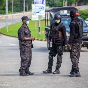 DSS operatives arrest five suspects linked to the Papiri Catholic school abduction as security agents display recovered rifles and ammunition.