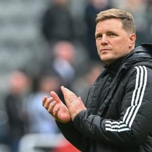 Eddie Howe applauds Newcastle United supporters after a Premier League match at St James' Park.