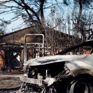 wildfire burning through pine forests near Bordeaux, France, as thousands of residents and tourists evacuate amid extreme heat.