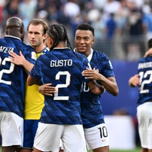 France forward Kylian Mbappe celebrates with teammate Malo Gusto ahead of France's 2026 World Cup quarter-final against Morocco.