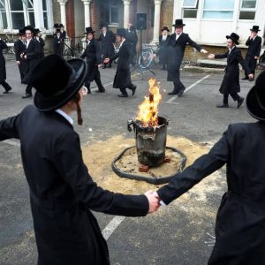 Ultra-Orthodox Jewish men celebrate Lag B’Omer with bonfires in north London under police presence