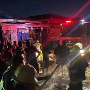 Firefighters respond to a fire outbreak that destroyed 17 shops at Sabo Market in Ikorodu, Lagos State, after a suspected electrical surge.
