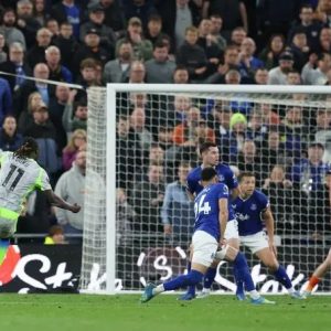 Jeremy Doku scores Man City's third goal at Everton