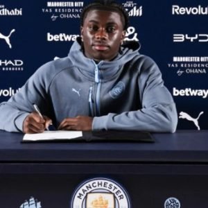 Jeremy Monga poses after signing for Manchester City following his transfer from Leicester City on a five-year contract.