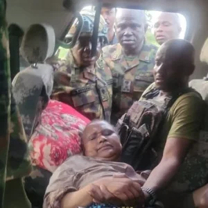 Nigerian troops evacuating a rescued the late general's wife to a military medical facility after a counter-offensive operation in Katsina State.