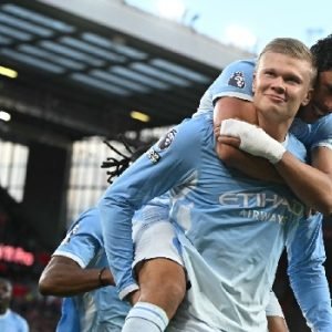 Manchester City's Erling Haaland celebrates with Matheus Nunes during the 3-0 Premier League victory over Liverpool at Anfield on 11 October 2026.