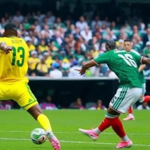 Mexico players celebrating a goal during World Cup opener at Estadio Azteca, with South Africa players reacting after a red card decision.