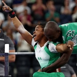Esther Nworgu celebrates after winning Nigeria's first gold medal in the women's lightweight para powerlifting event at the 2026 Commonwealth Games in Glasgow.
