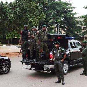 Police officers and security operatives at the National Institute for Policy and Strategic Studies (NIPSS) Kuru following an armed attack in Plateau State, Nigeria.