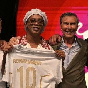 Ronaldinho holds a Ravenna FC jersey during the Italian club's team presentation in Marina di Ravenna.