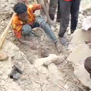 Rescue workers search through rubble after three-storey building collapse in Durumi area of Abuja