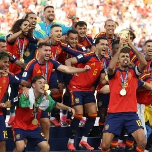Spain players celebrate with the FIFA World Cup trophy after defeating Argentina 1-0 in the 2026 World Cup final.