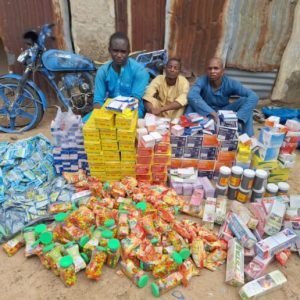 DSS operatives and forest guards conducting an anti-terrorism operation in forested areas of Borno State, Nigeria, inspecting seized medical supplies allegedly linked to ISWAP logistics networks.