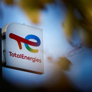 FILE PHOTO: A sign with the logo of French oil and gas company TotalEnergies is pictured at a petrol station in Bouguenais near Nantes, France, November 14, 2022. REUTERS/Stephane Mahe/File Photo