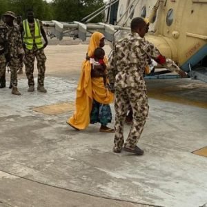 Rescued women and children receive assistance after being freed from an ISWAP enclave during Operation Hadin Kai operations in Borno State.