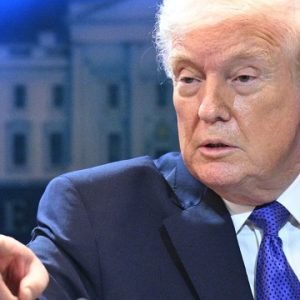 Donald Trump addressing reporters amid claims of a US military helicopter being shot down over the Strait of Hormuz during tensions with Iran.