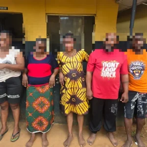 Police officers and suspects following the alleged baby factory operation in Mowe, Ogun State.
