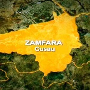 Security personnel and damaged vehicles following a terrorist ambush on travellers along the Magami-Dansadau road in Zamfara State.