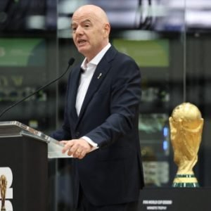Gianni Infantino speaking at a FIFA event during the 2026 World Cup in Dallas.