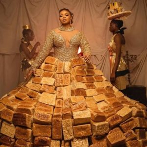 Queen Mercy Atang wearing her bread-inspired outfit on the AMVCA 12 red carpet in Lagos.