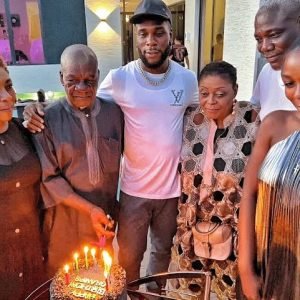 Burna Boy at the 90th birthday celebration in Lagos honouring his grandfather Benson Idonije during a family event.