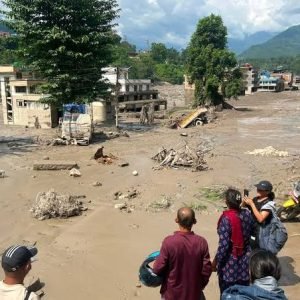 Rescue workers search flood-hit areas in Nepal after deadly flash floods on the Nepal-Tibet border.