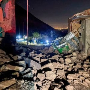 Rescue workers assess collapsed homes after a 5.1 magnitude earthquake struck Chongos Bajo in Peru's Andes region.