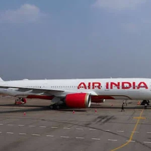 Air India passenger aircraft at an airport following a security alert and diversion to Jaipur over a reported hijacking rumour.
