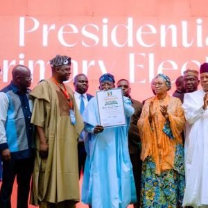 President Bola Ahmed Tinubu receives APC certificate of return after winning the party’s 2027 presidential primary election in Abuja.
