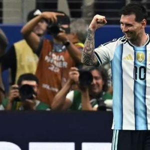 Lionel Messi celebrates after scoring during Argentina's 2-0 World Cup victory over Austria in Arlington, Texas, becoming the tournament's all-time leading goalscorer.