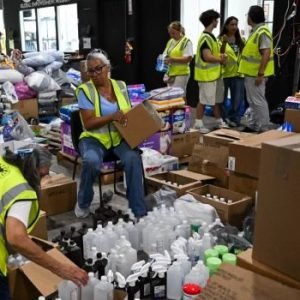 Volunteers prepare humanitarian aid while the United States deploys warships, aircraft and rescue teams following the deadly Venezuela earthquakes.