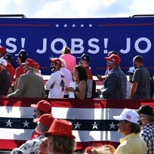 Donald Trump supporters at a campaign event as the latest US jobs report shows the American economy lost 23,000 jobs in July ahead of the midterm elections.